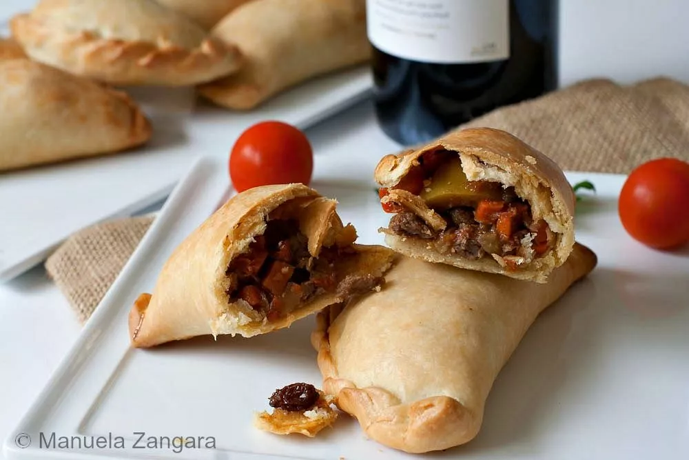 Baked Argentinian empanadas filled with savoury meat and vegetables.
