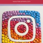 Finished Instagram Cake decorated with coloured chocolates and fondant logo.