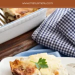 Slice of Low FODMAP Moussaka served on a white plate with creamy béchamel and visible layers.