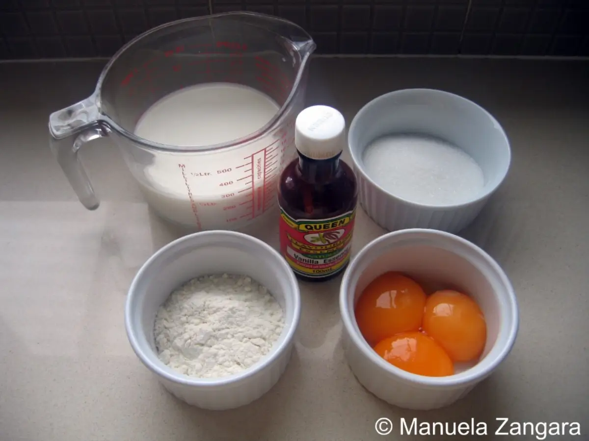 Prepared ingredients for Creme Patissiere including milk, vanilla, sugar, flour, and egg yolks.
