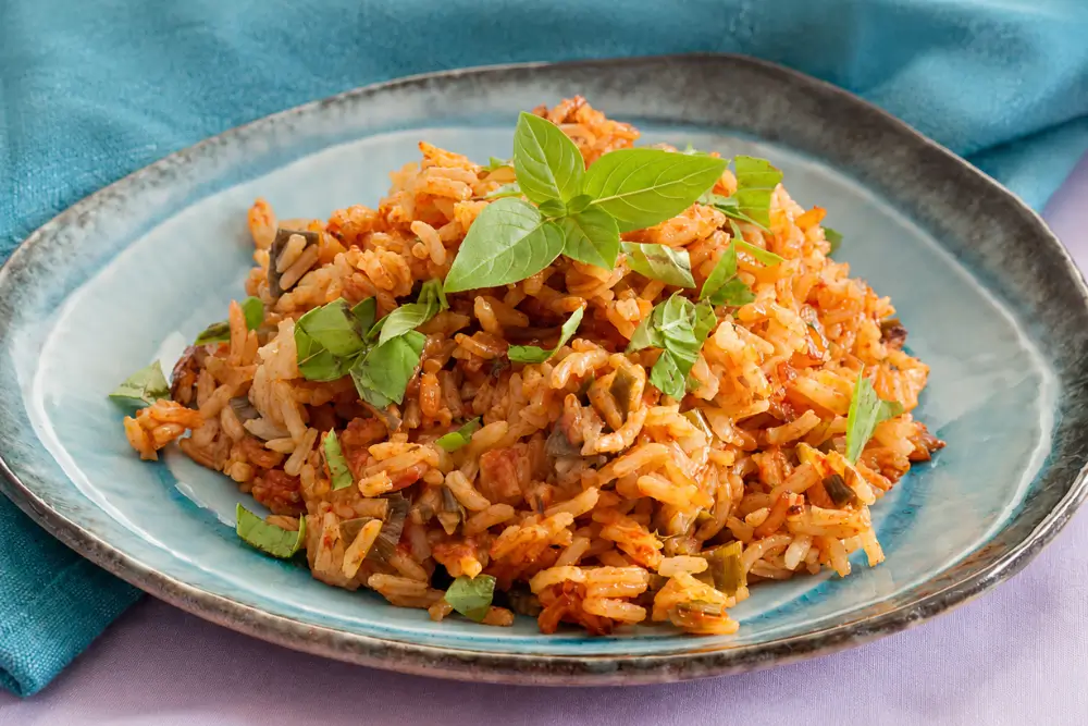 Low FODMAP rice with tomato and basil served warm.