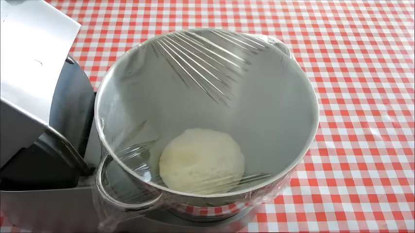 Koeksisters dough covered with cling film and left to rest before shaping.