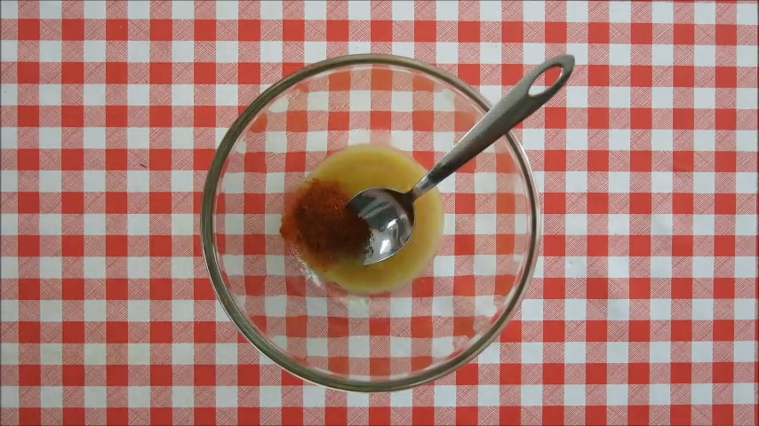 Butter, maple syrup, and spices mixed in a bowl for homemade maple glazed macadamia nuts.