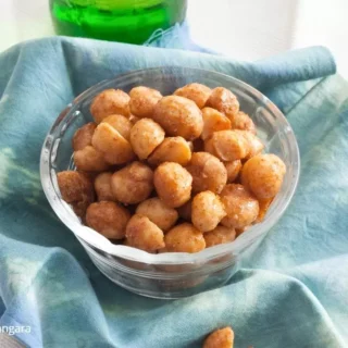 Close-up of sweet and spicy macadamia nuts, a gluten-free snack idea.