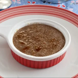 Coffee Crema Catalana with crisp caramelised sugar crust served on a plate.