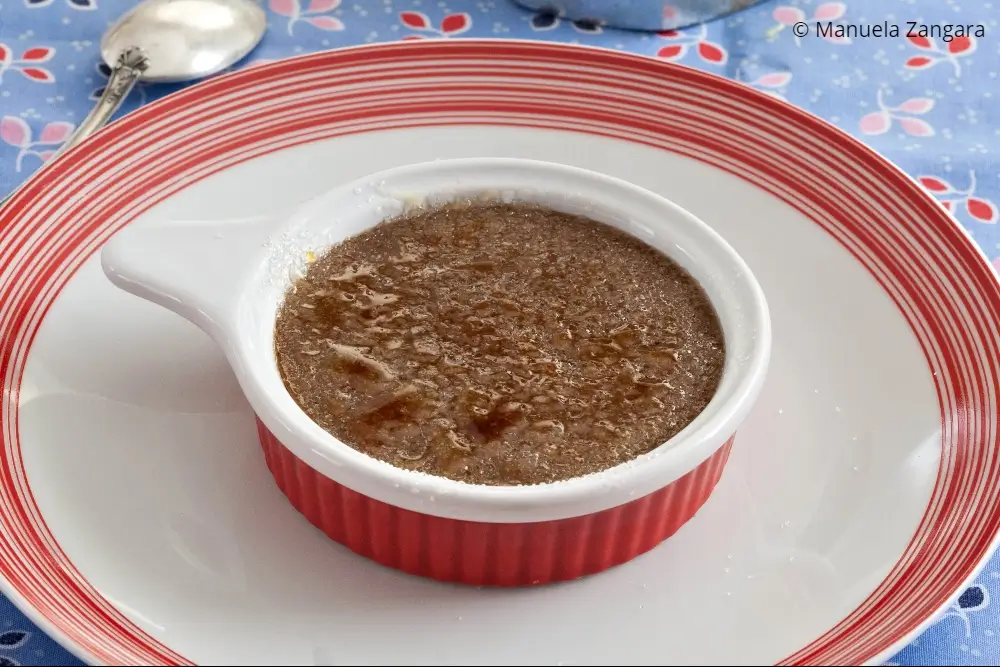 Coffee Crema Catalana with crisp caramelised sugar crust served on a plate.