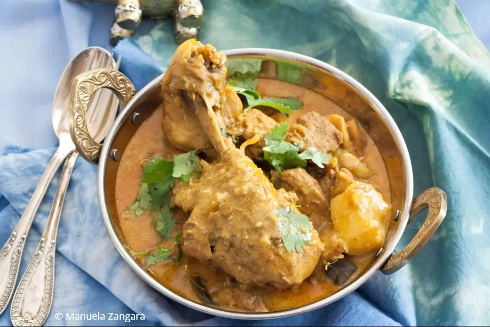 Low FODMAP chicken curry served in a bowl with coriander.