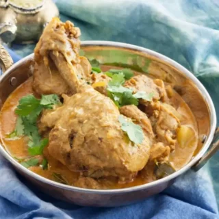 Low FODMAP Chicken Curry with tender potatoes and herbs in a rich sauce.