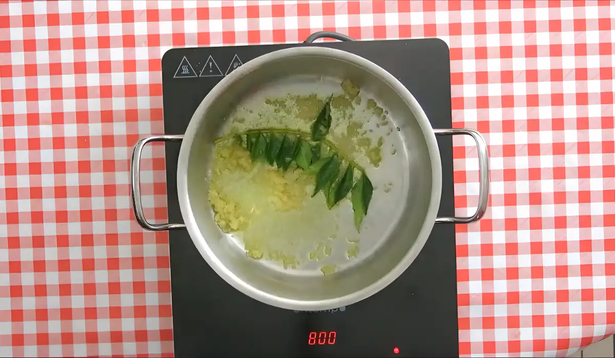 Ginger and curry leaves sautéing in garlic-infused oil.