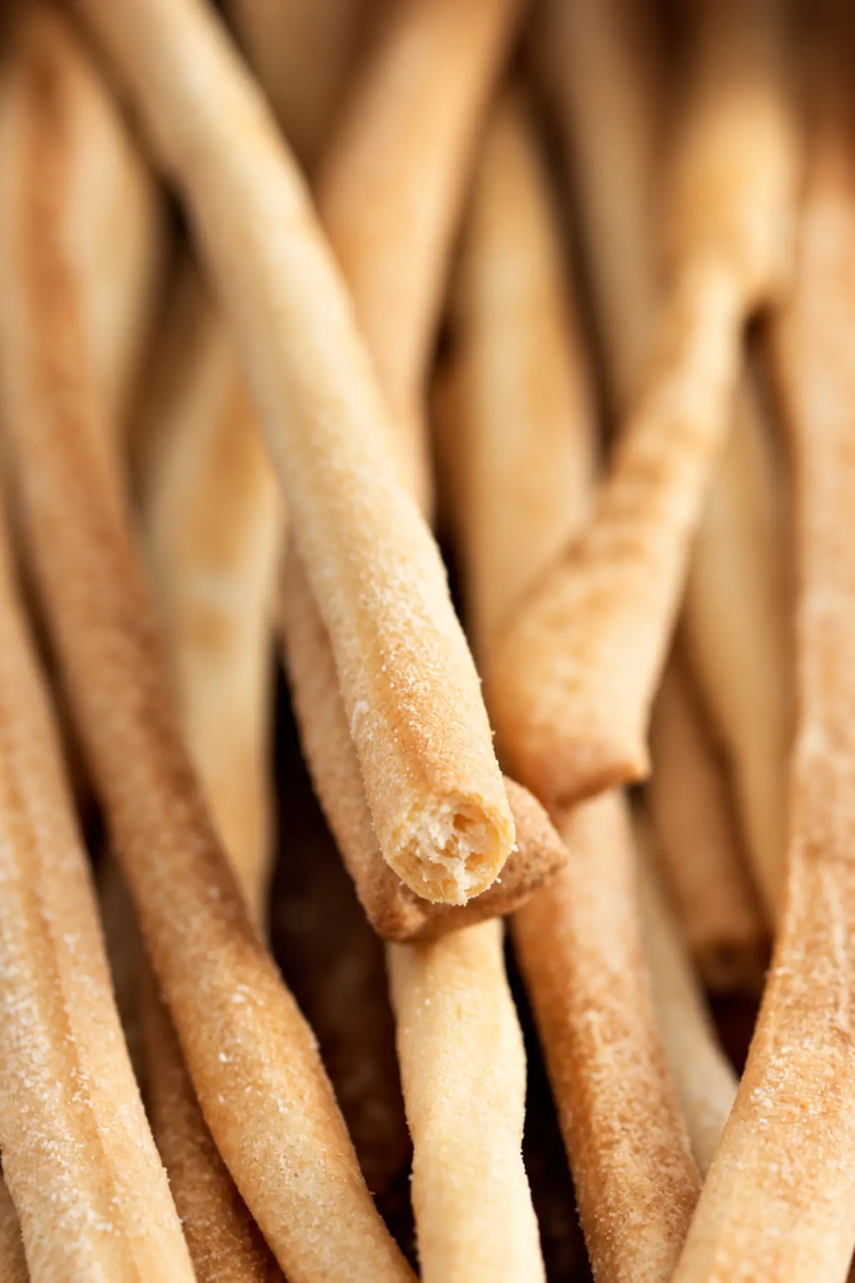 Close-up of a crisp breadstick showing its delicate baked texture.