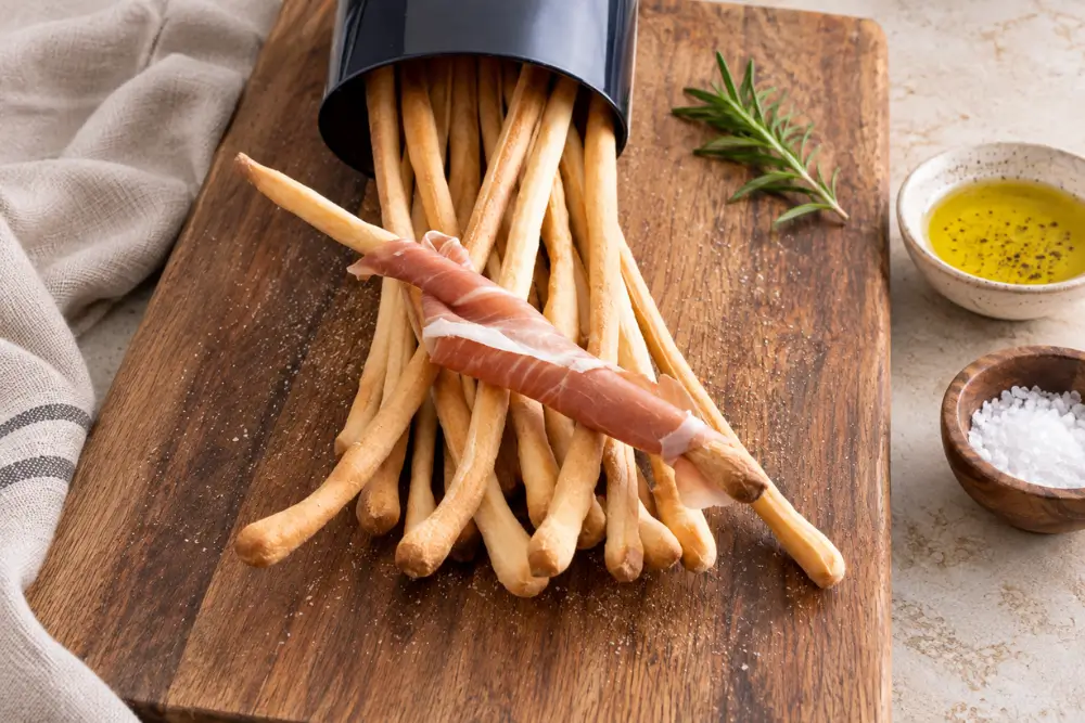 Sourdough Grissini served with Prosciutto, olive oil and sea salt.