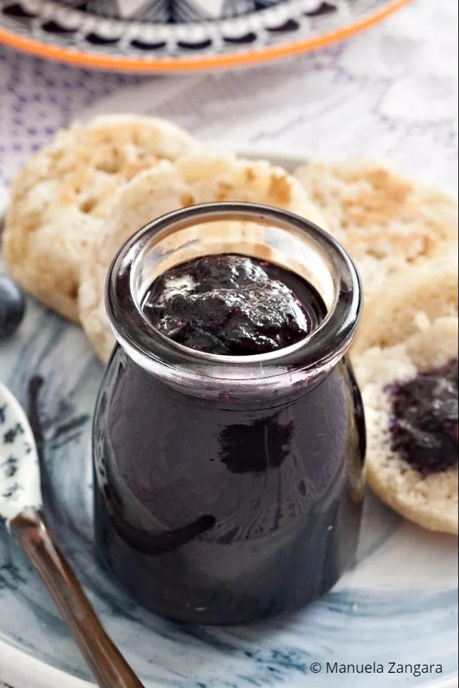 Homemade blueberry jam ready to spread on toast or crumpets.