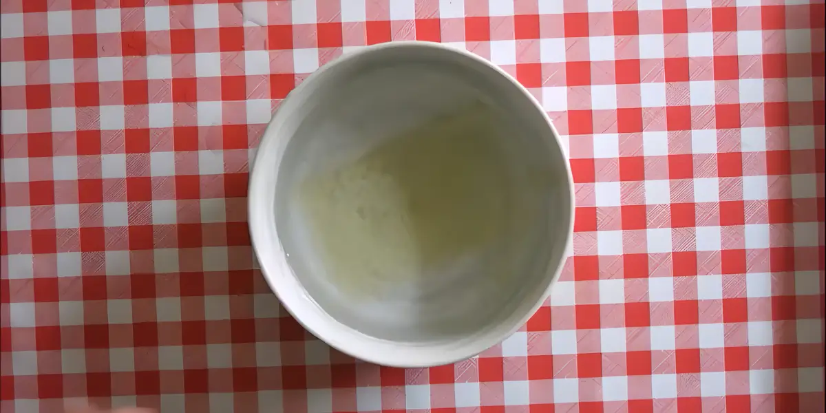 Gelatine sheets soaking in cold water before softening.