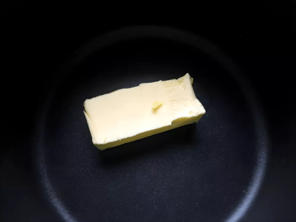 Butter melting gently in a non-stick saucepan to start the roux.