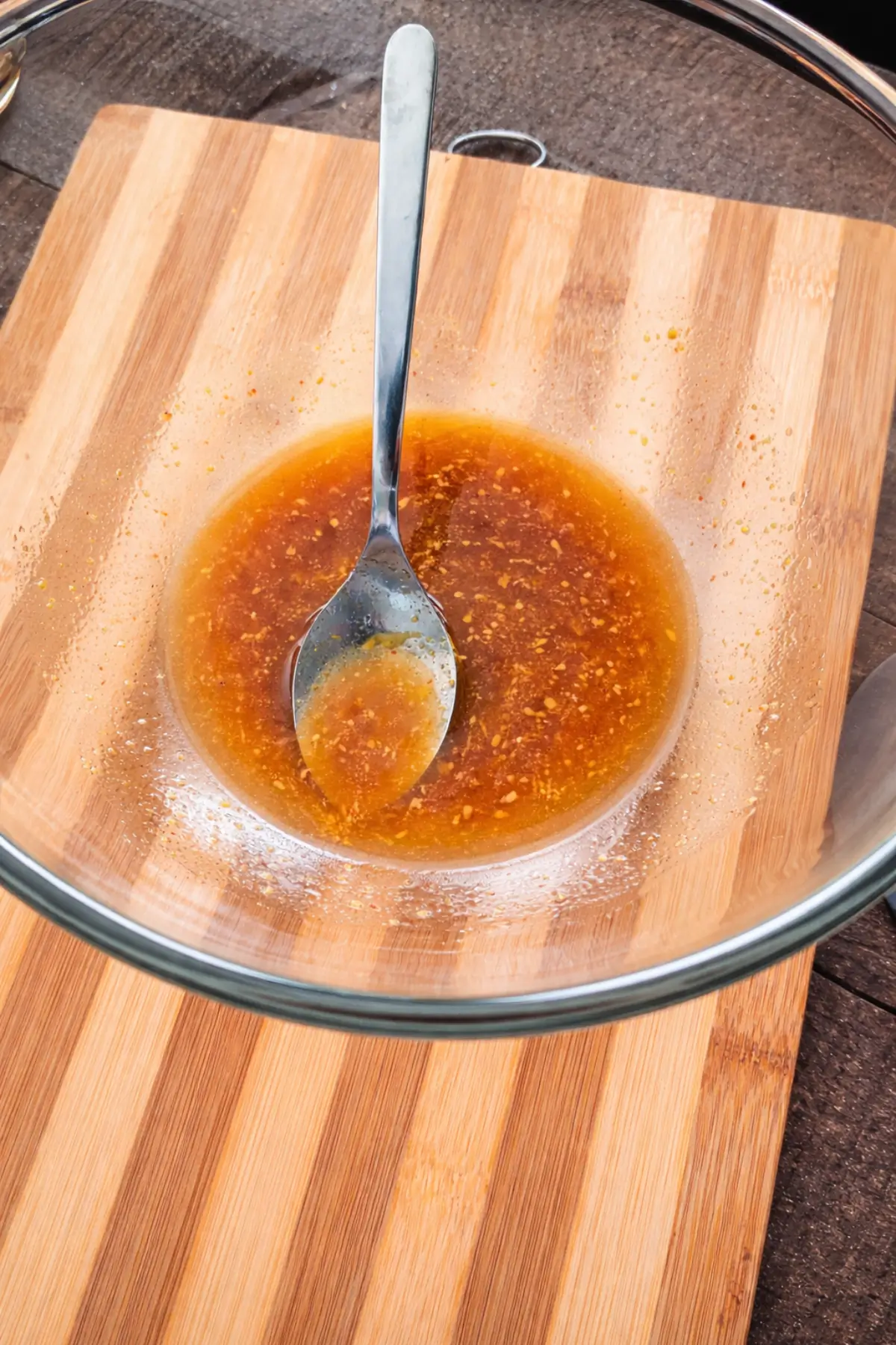 Maple syrup, sriracha, and seasoning mixed in a bowl to make the glaze.