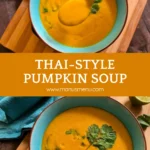 Smooth pumpkin soup garnished with coriander in a blue bowl.