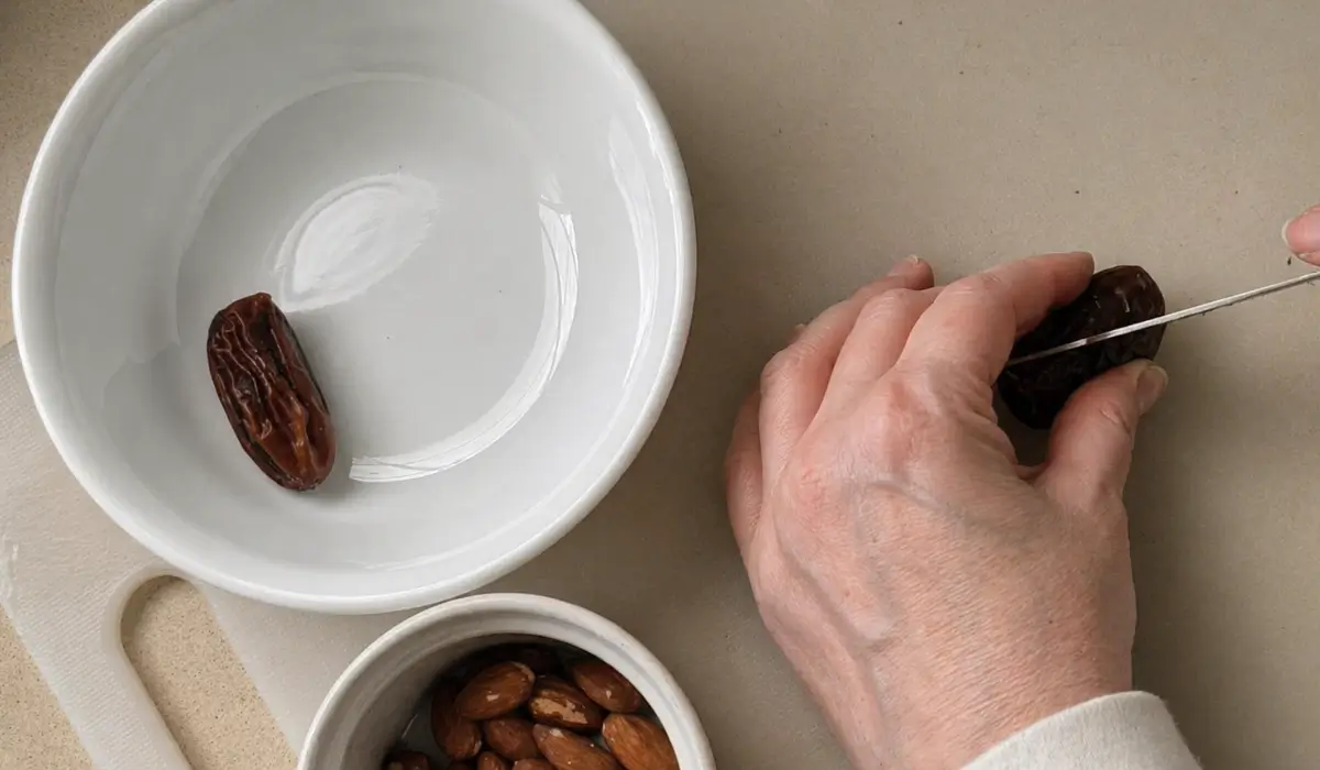 Cutting dates at an angle before shaping the hearts.